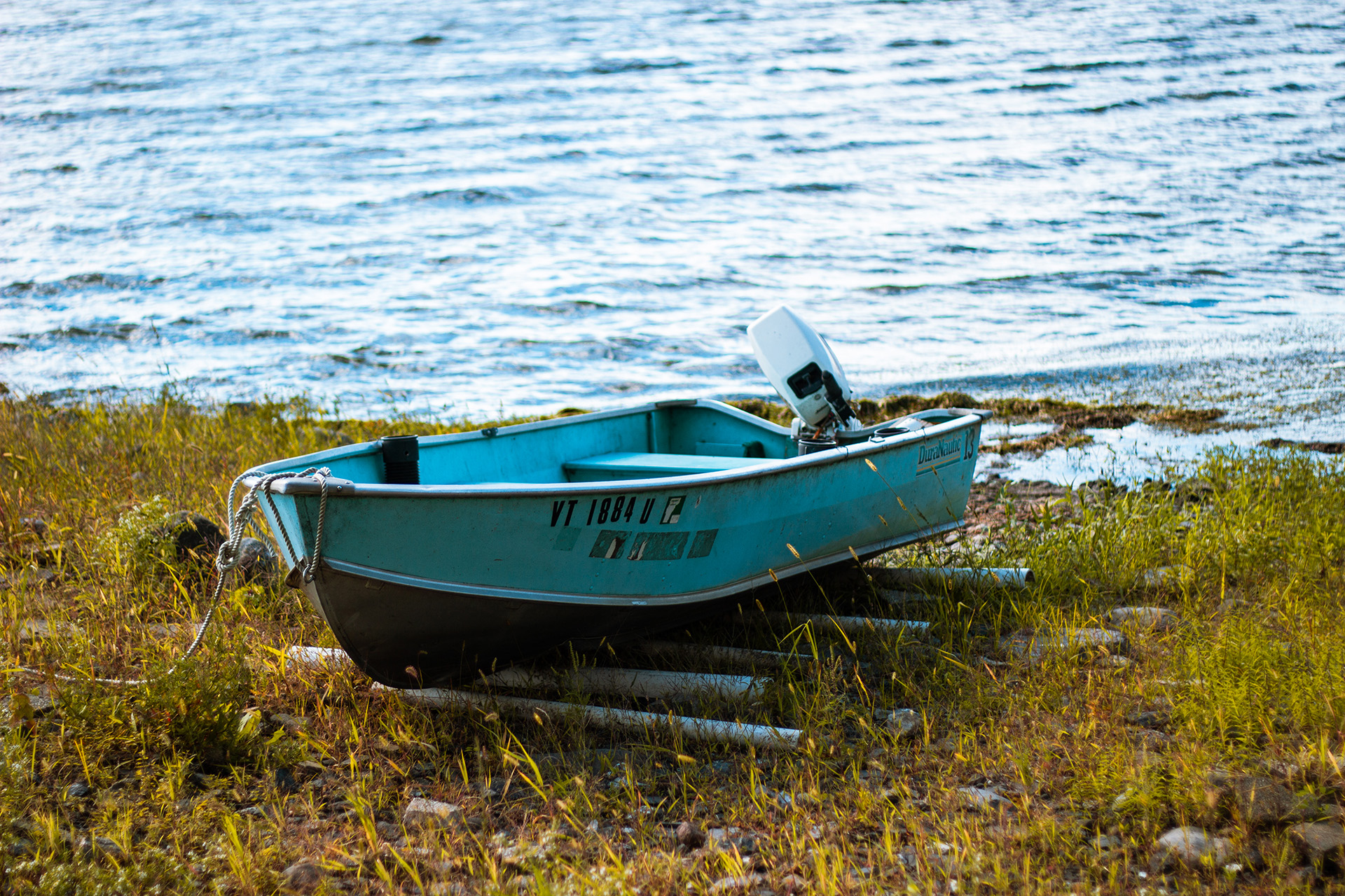 A small fishing boat pulled on shore for the season