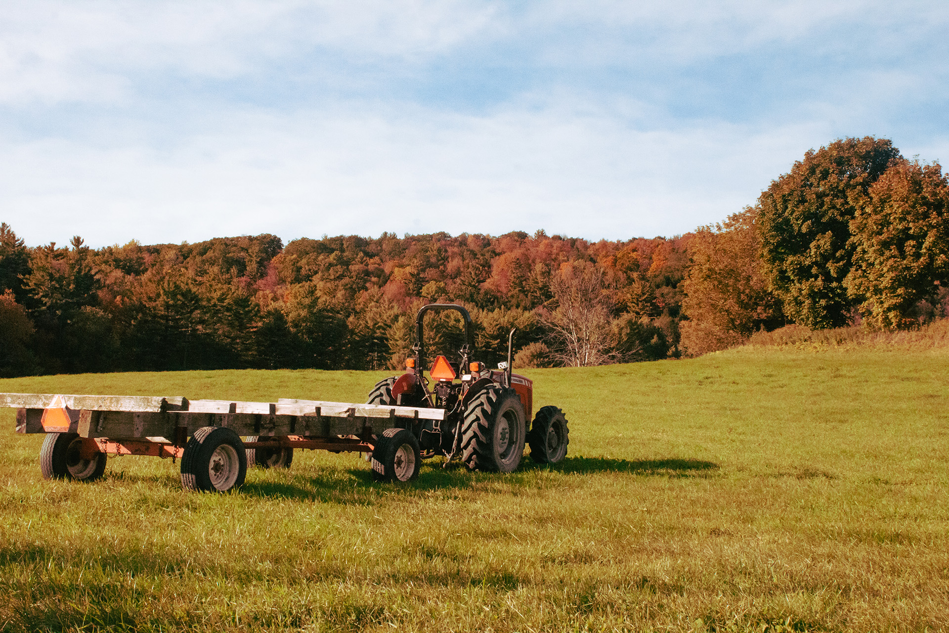 A tractor with a wagon in a field